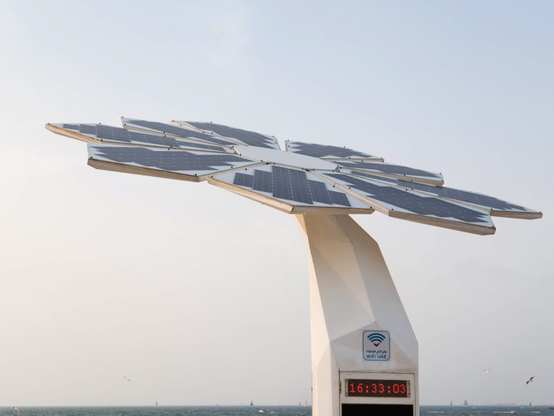 Photovoltaic panel on top of shower standing on the beach.